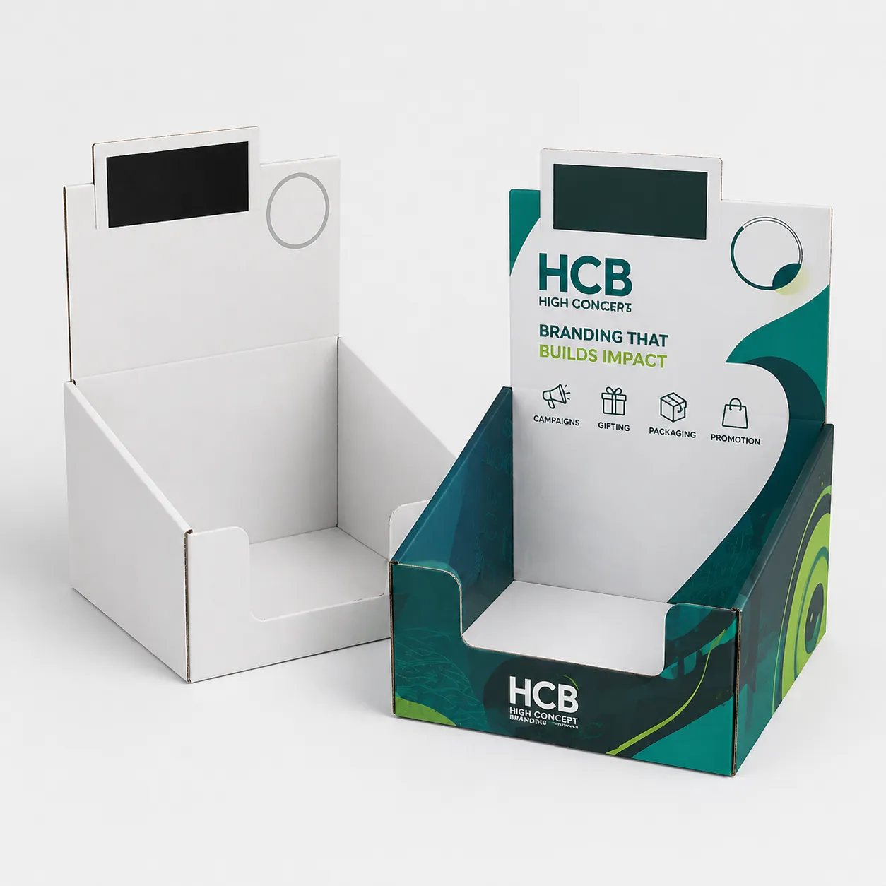 White and branded teal cardboard countertop display boxes for retail products. class=